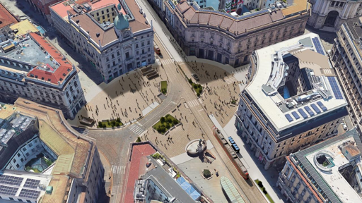 Vista aerea di Piazza Cordusio a Milano, caratterizzata da un ampio spazio pedonale affollato, circondato da edifici storici e moderni. Si possono notare strade che si incrociano e diverse persone che passeggiano.