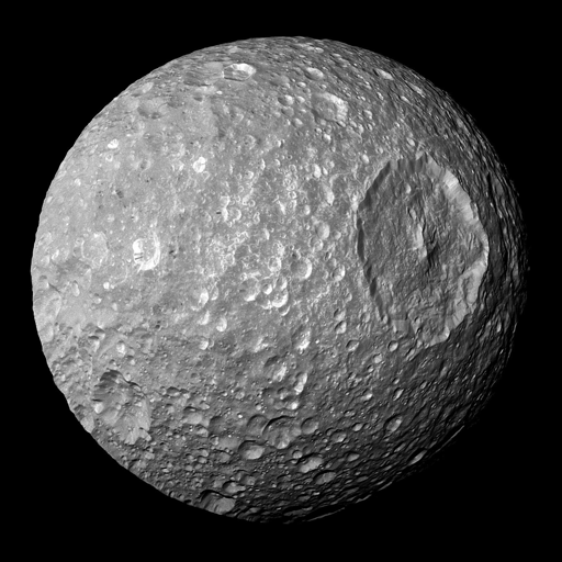 La luna Mimas di Saturno, fotografata dalla sonda Cassini. Un nuovo studio mostra come lune di ghiaccio così piccole potrebbero mantenere un oceano liquido sotto una crosta ghiacciata e come ciò potrebbe dare origine a caratteristiche superficiali.