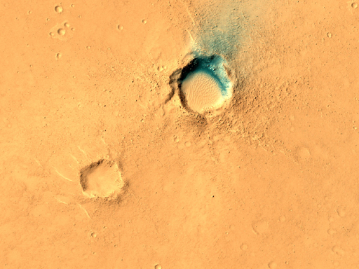  Quest'area mostra un'anomalia termica nei dati THEMIS, che indica un potenziale ingresso di una caverna o semplicemente una depressione con elevata inerzia termica. Tuttavia, per distinguere tra queste due ipotesi, sono necessarie immagini HiRISE. L'area di interesse si trova su giovani colate laviche nella regione di Elysium".